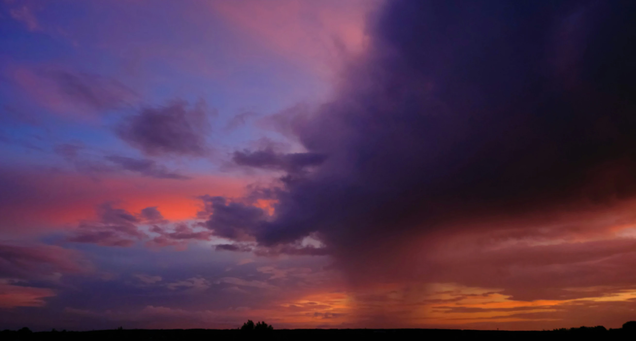 a sunset view with a very bright red cloud