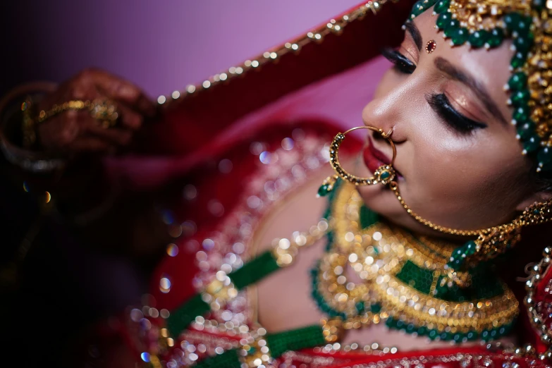 a woman is wearing a very beautiful outfit and veil