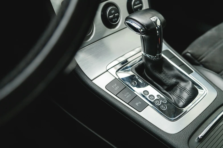 a car's gear stick is seen in this pograph