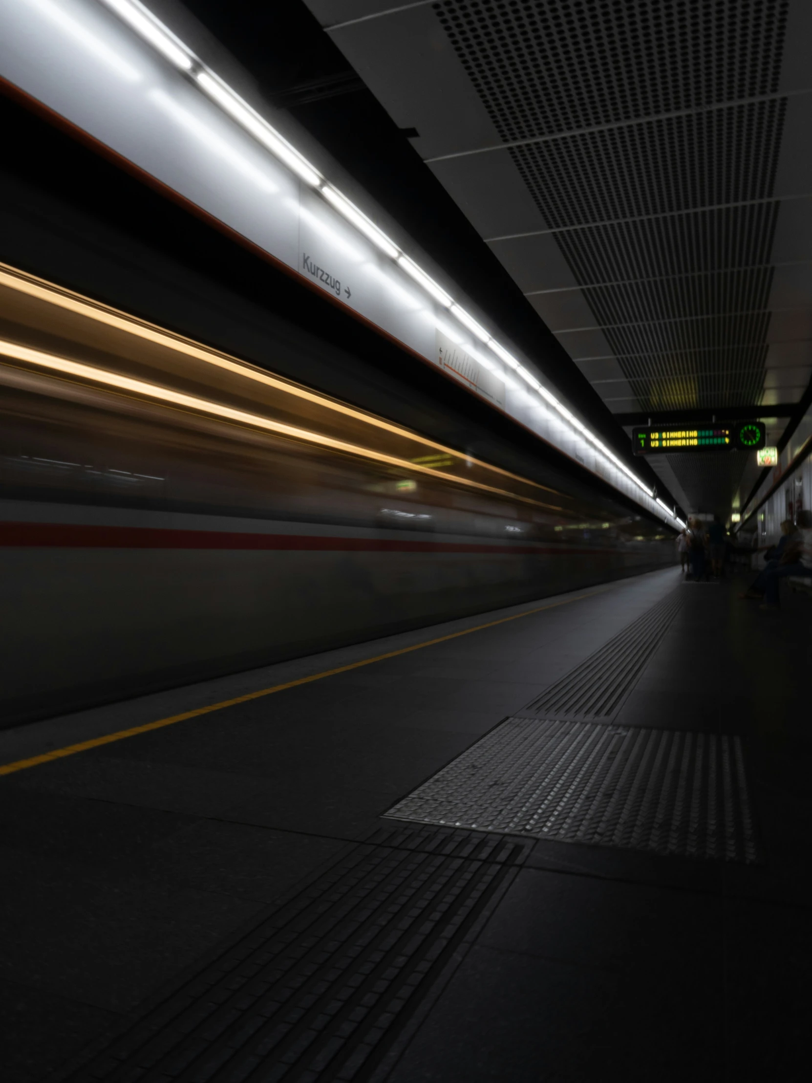 a moving train is coming in the subway