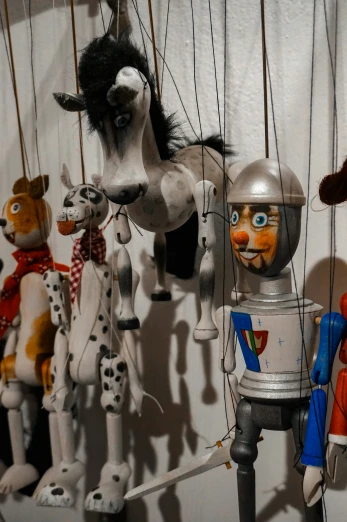 vintage toys hanging from hooks with horse, dog, and giraffe decorations