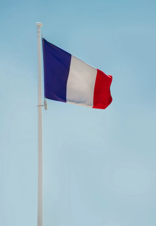 an european flag flying against a blue sky