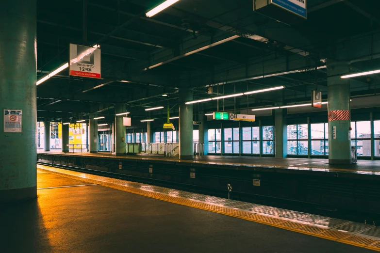 the view of a train station, as seen from a platform