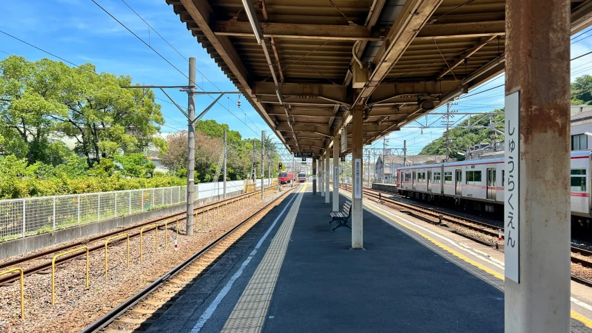 train station with two silver trains next to each other