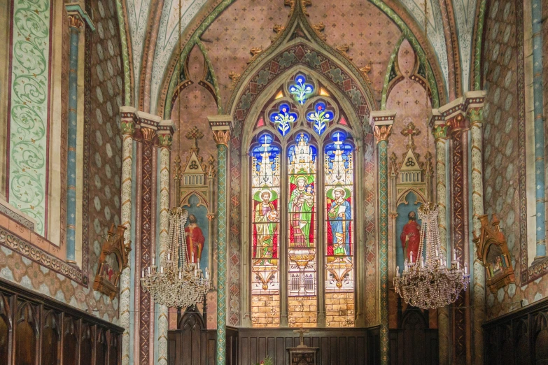 a po taken inside of an old church of a stained glass window