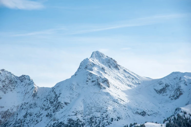 snow covered mountains against a blue sky