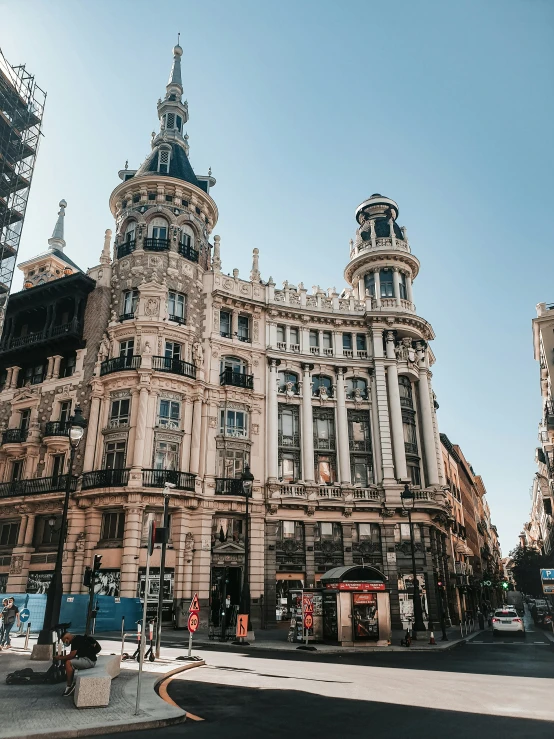 the building has multiple windows and many towers on it