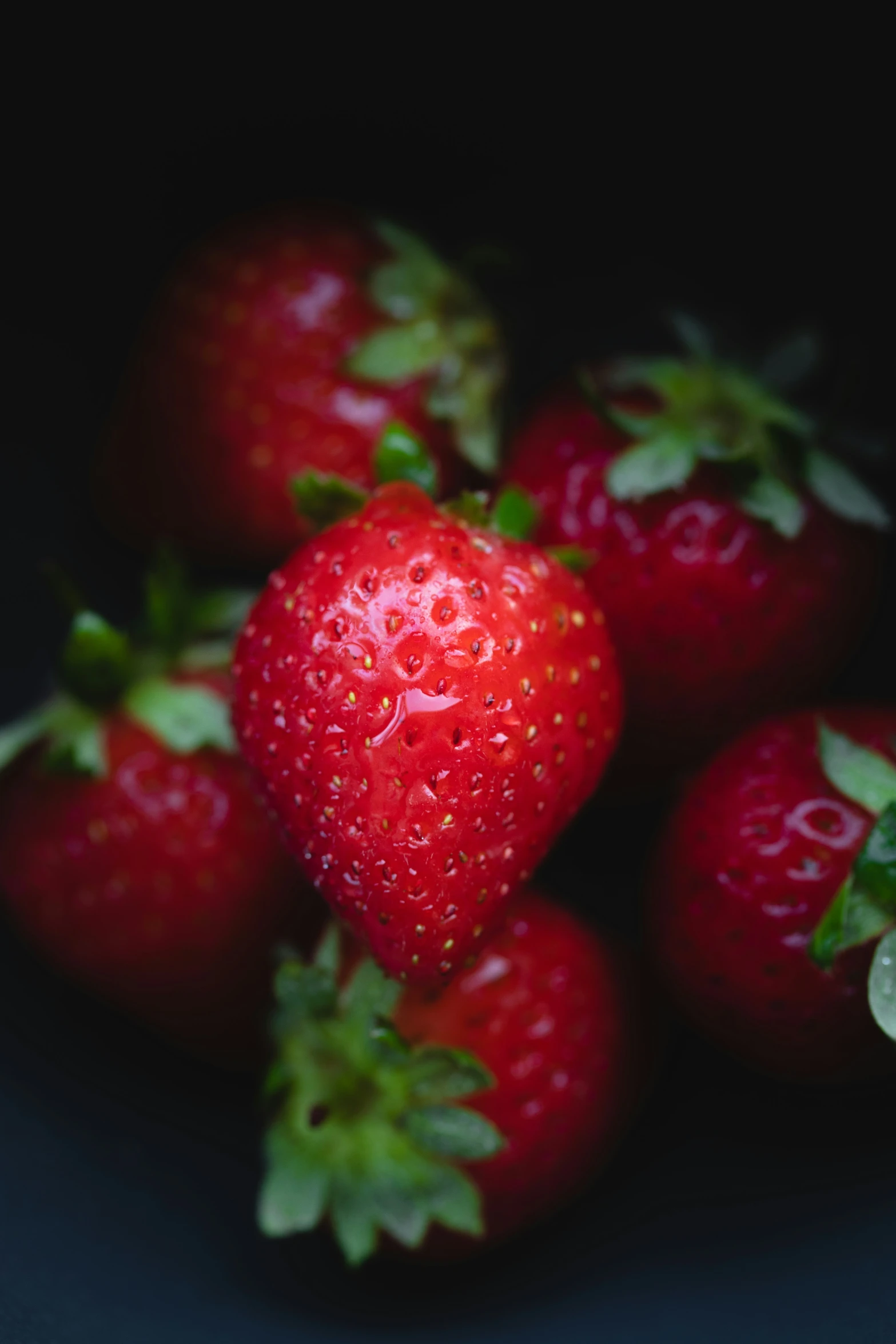 there are many ripe strawberries in a bowl