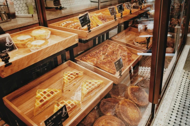 a bakery counter filled with bread and other pastries