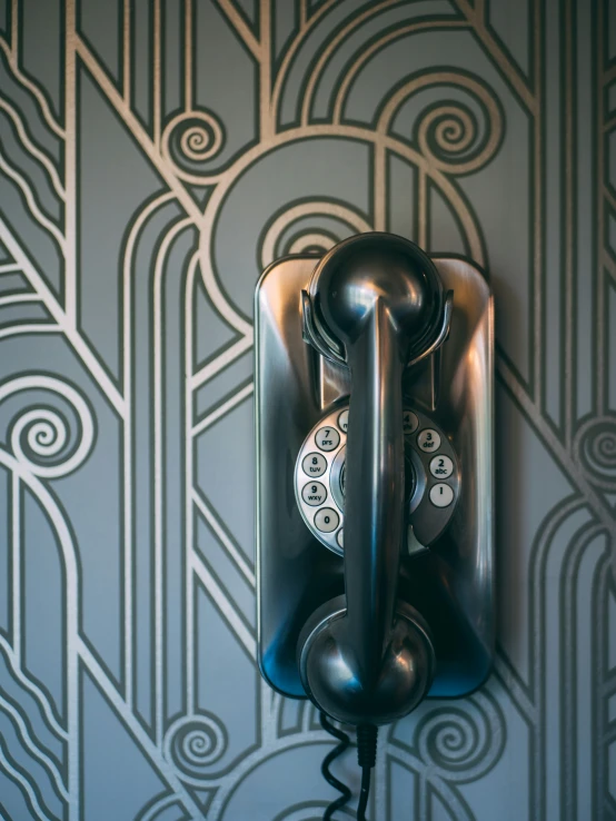 an old - fashioned telephone on the wall in a room