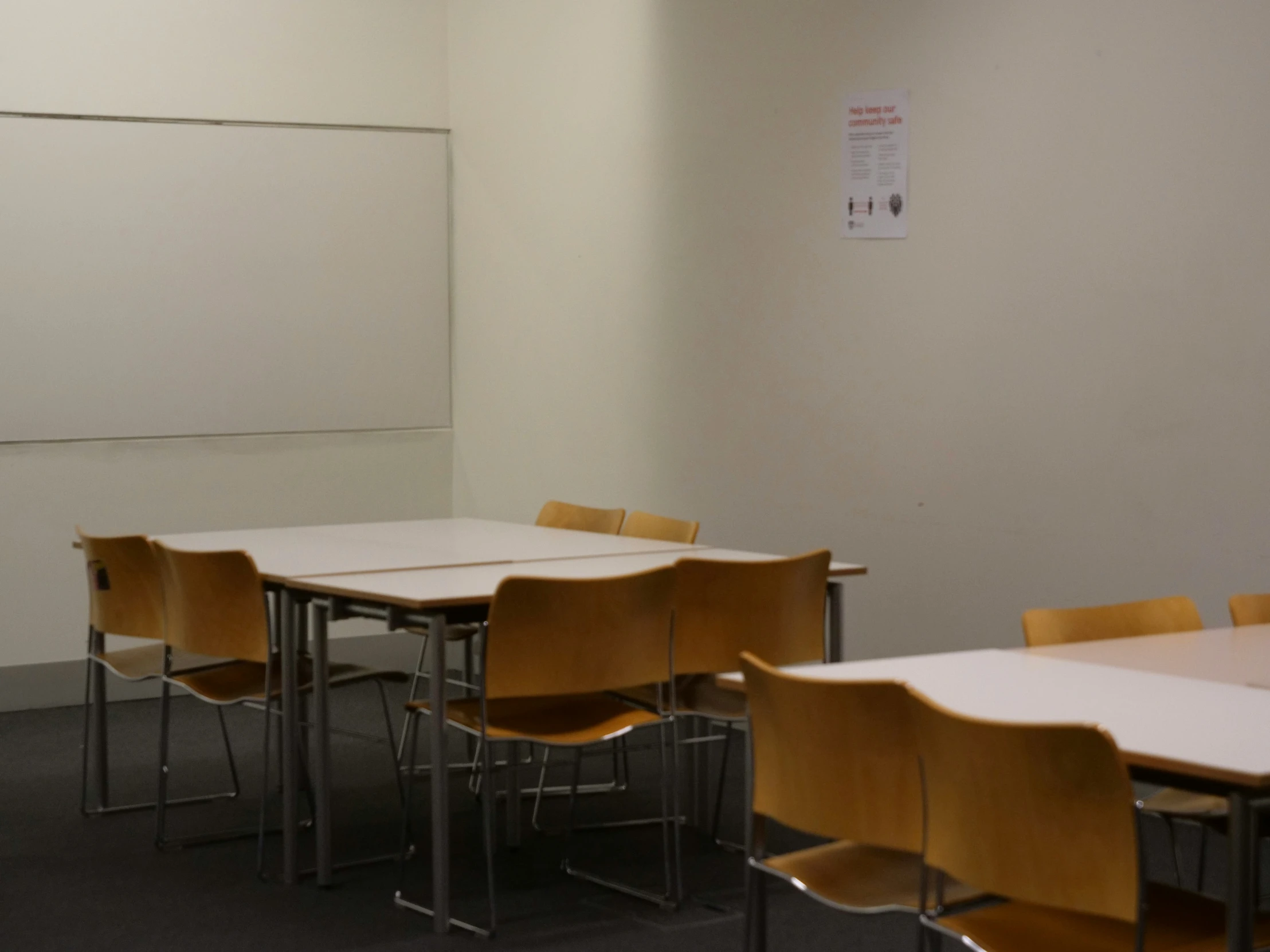 empty classroom with desks and chairs for students