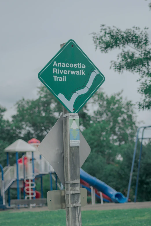 a sign is posted near a playground