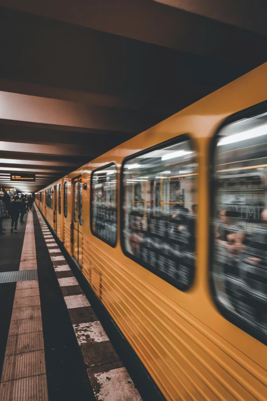 a view of people in subway train car passing by