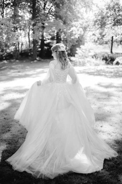 the back of a woman in a wedding dress