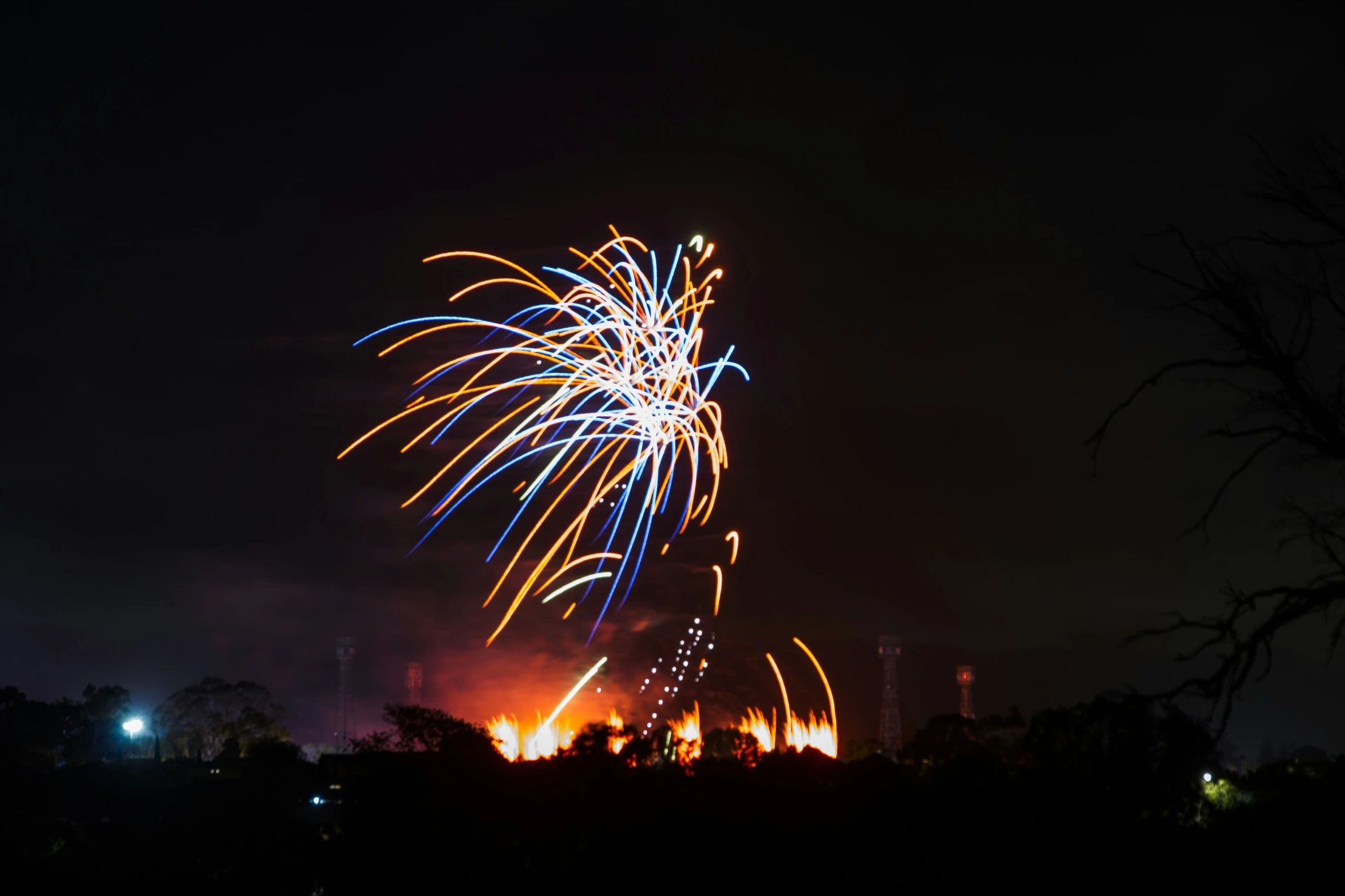 colorful fireworks coming out from the sky at night