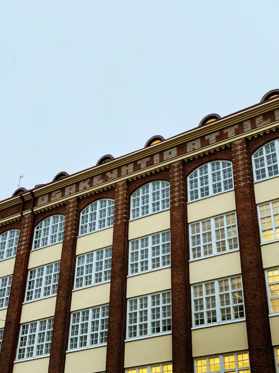 a very large brown building with many windows