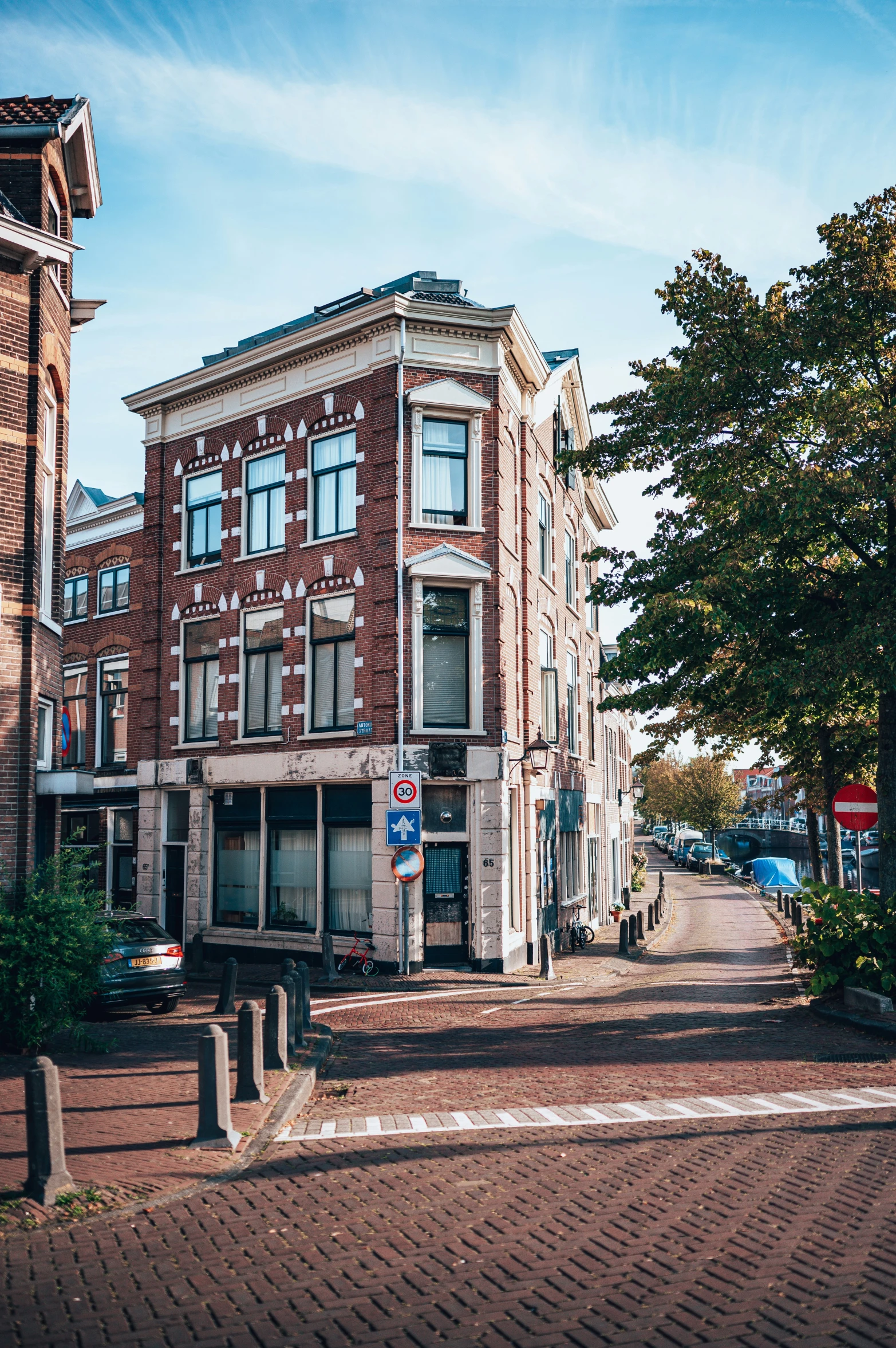 old brick buildings sitting next to each other on a street