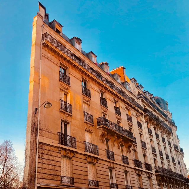 the building is tall with many windows near by