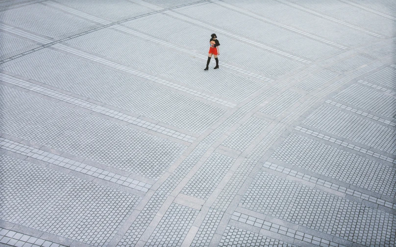 there is an aerial view of a woman on a cross country ski slope