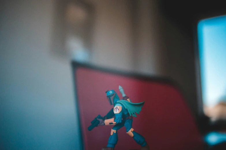 a closeup of a toy figurine on a computer screen