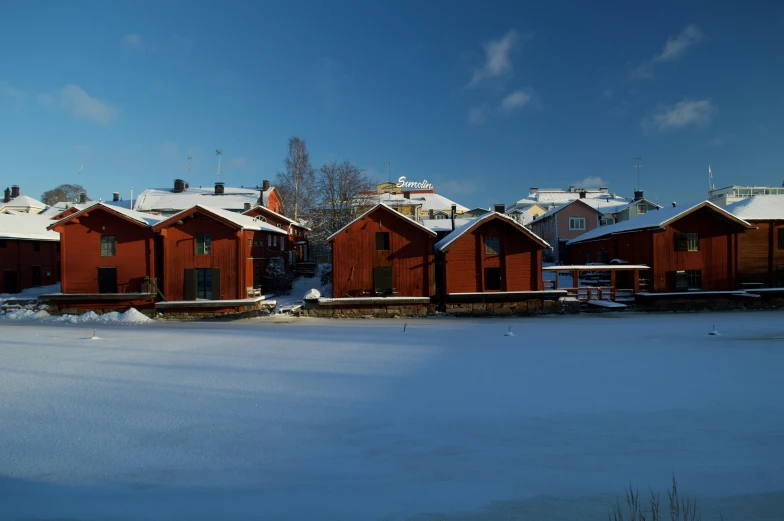 the small town is covered with a snow blanket