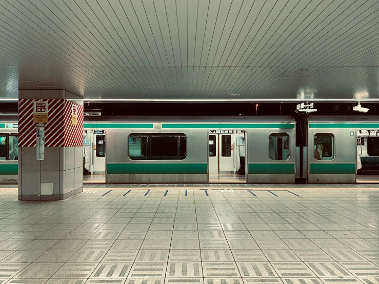 an empty subway station with multiple doors