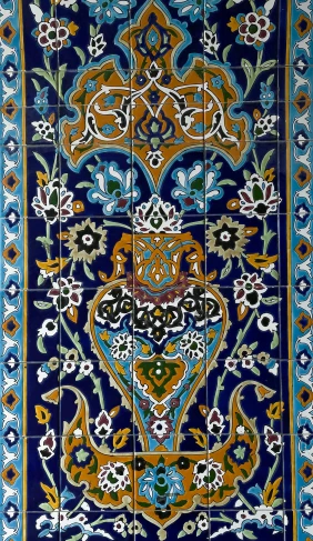 an artisticly painted tile on the front of a building