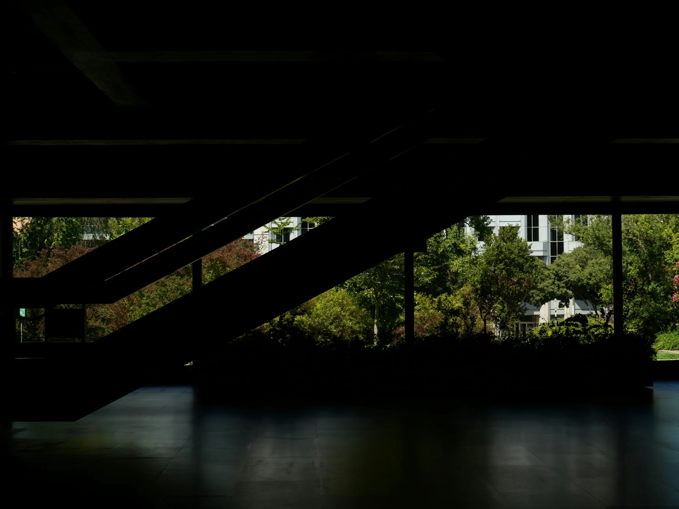 a person walking in a dark open building