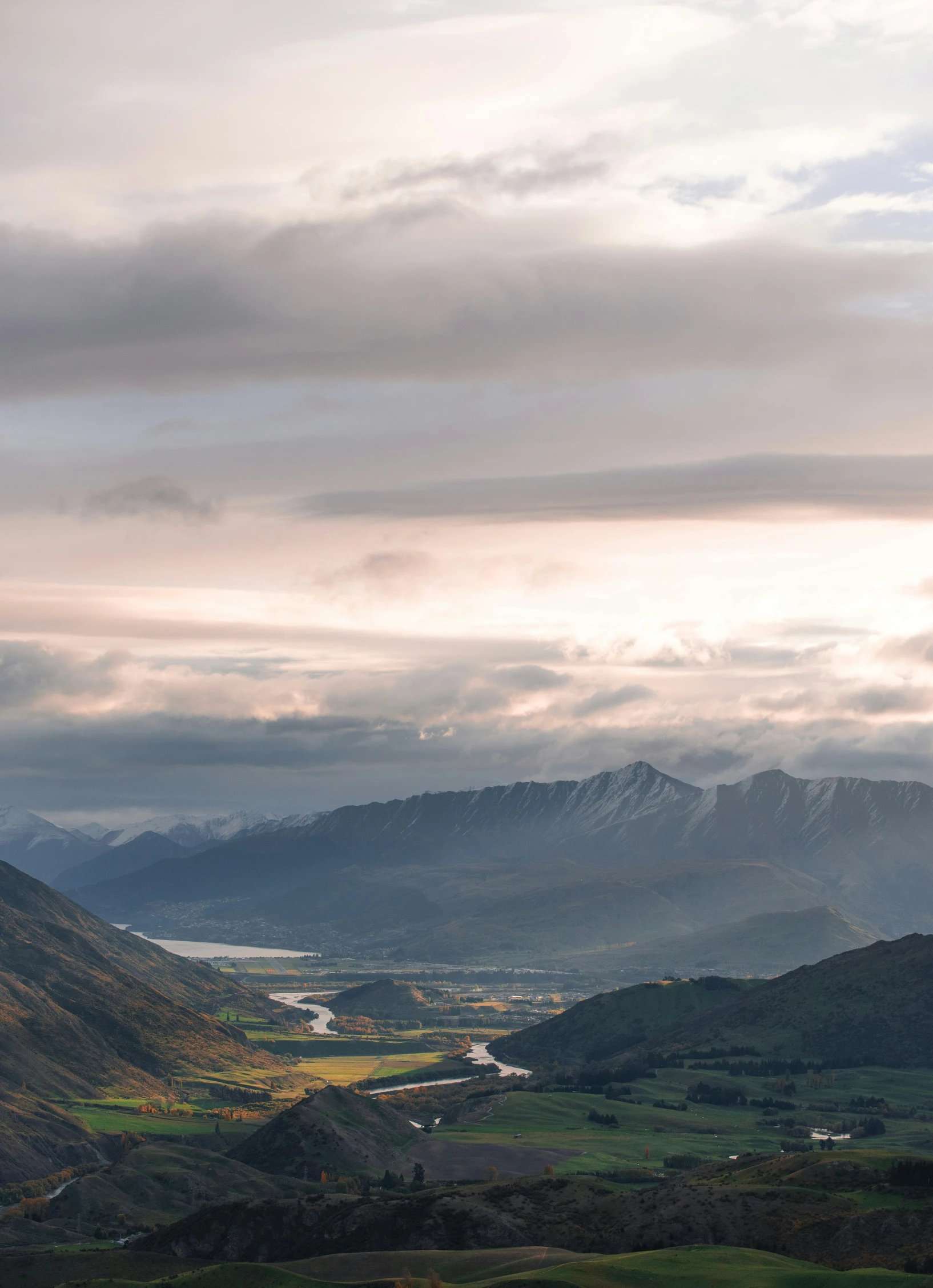 an aerial view looking down at mountains and lakes