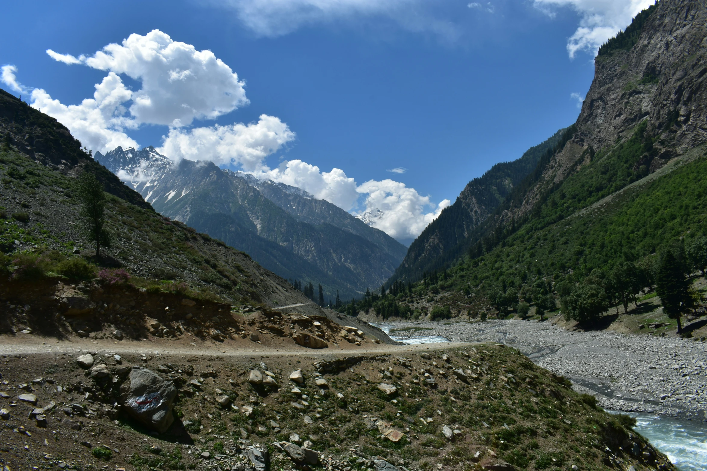 the mountains surrounding the river cover many hills