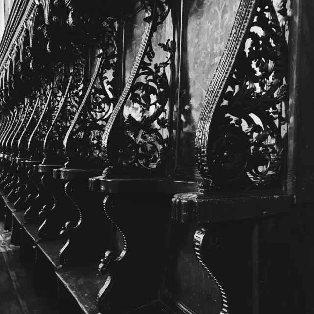 a black and white po of clocks against a wall