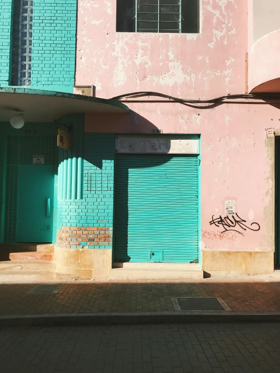 the door to a blue building in front of it