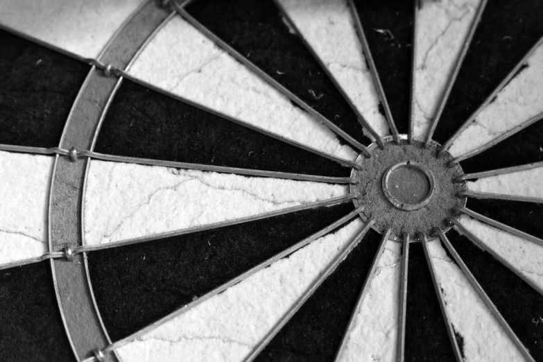 black and white image of an intricately made dart board