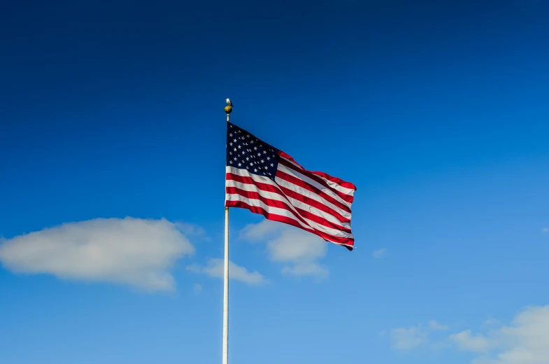 an american flag on top of a pole