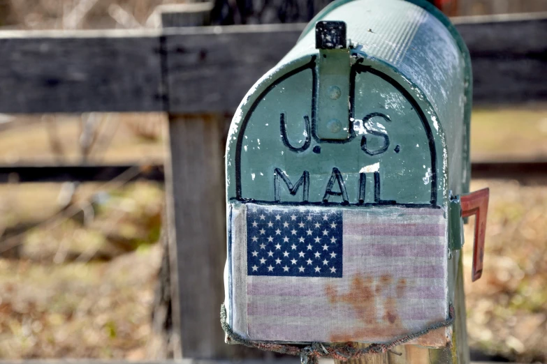 mailbox with arabic lettering and american flag on it