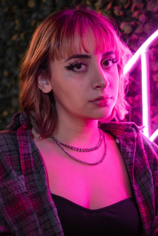 a close up of a person wearing a pink light