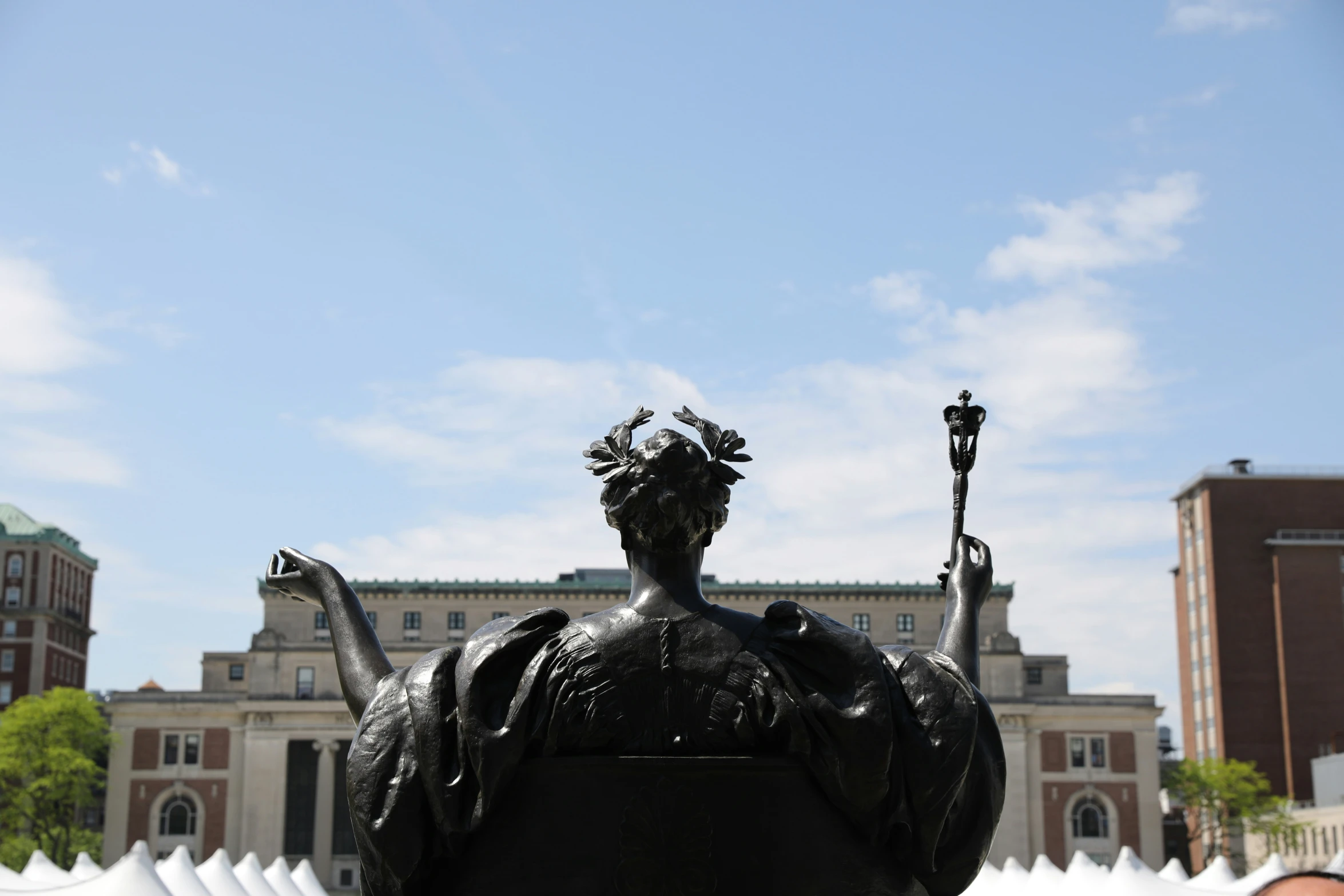 there is a statue of a woman holding a sword