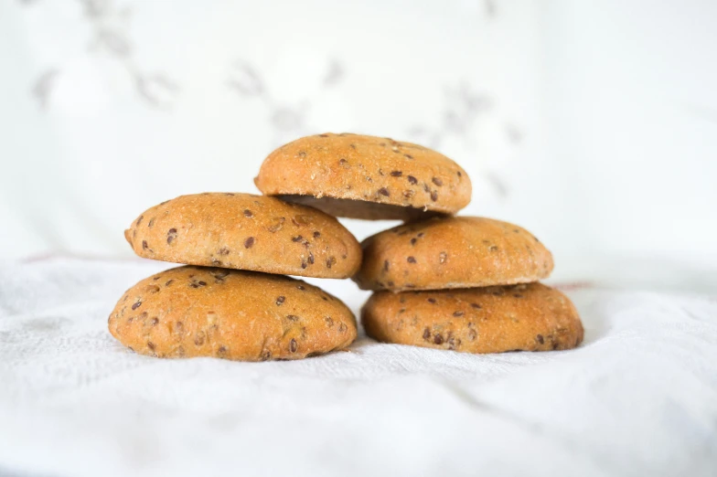 four cookies that have been placed on a white table