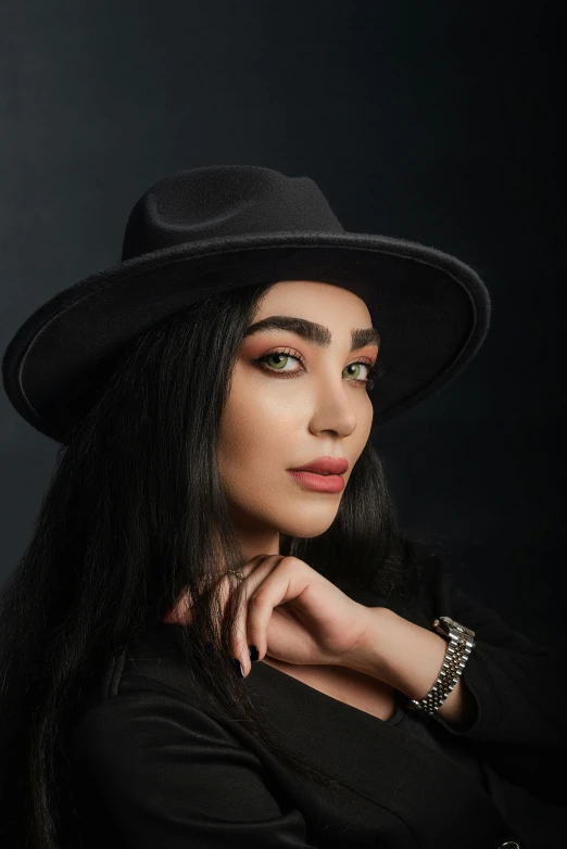 a beautiful woman wearing a large hat