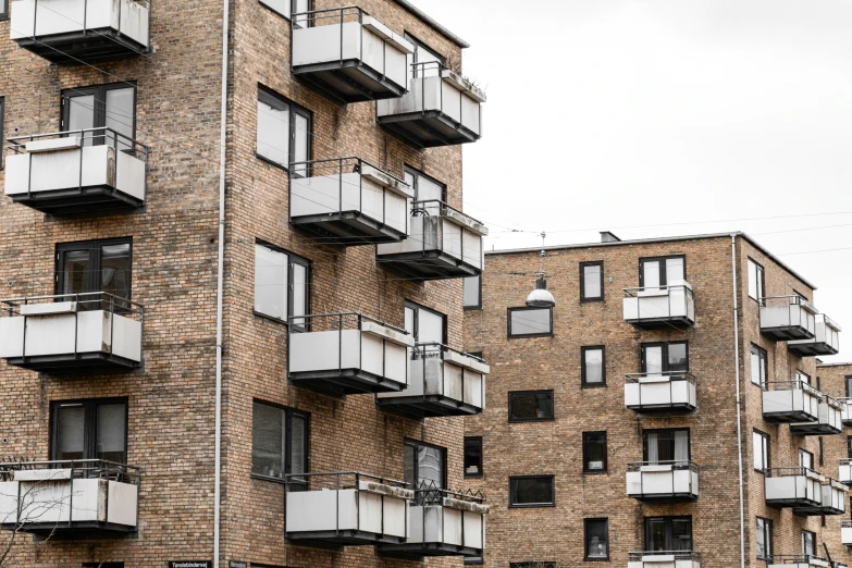 an apartment building with multiple balconies on the side