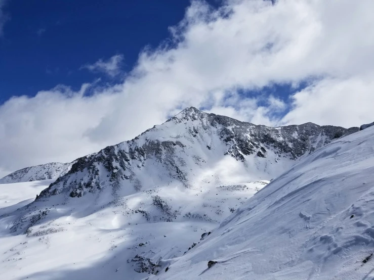 there is a big snow covered mountain on the ground