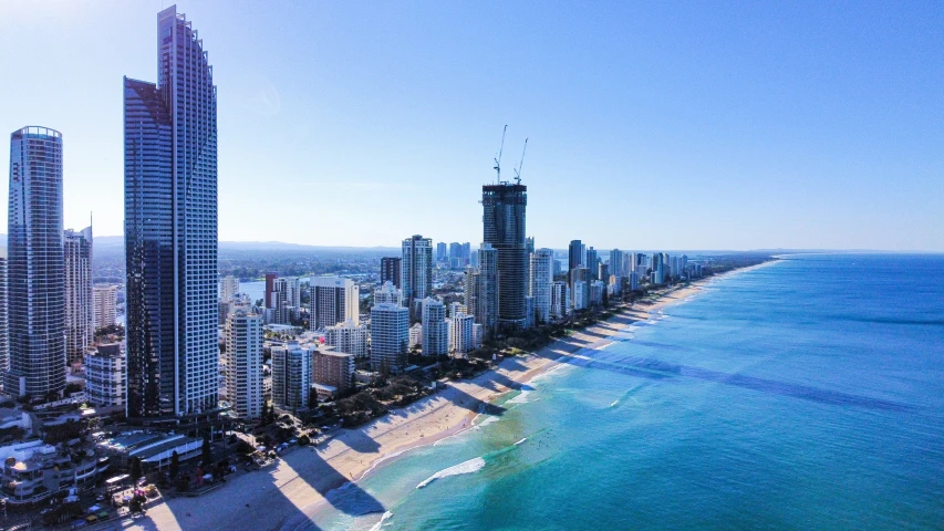 an aerial view of a city with high rise buildings in the background