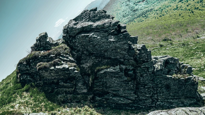 an image of a stone structure near the ocean