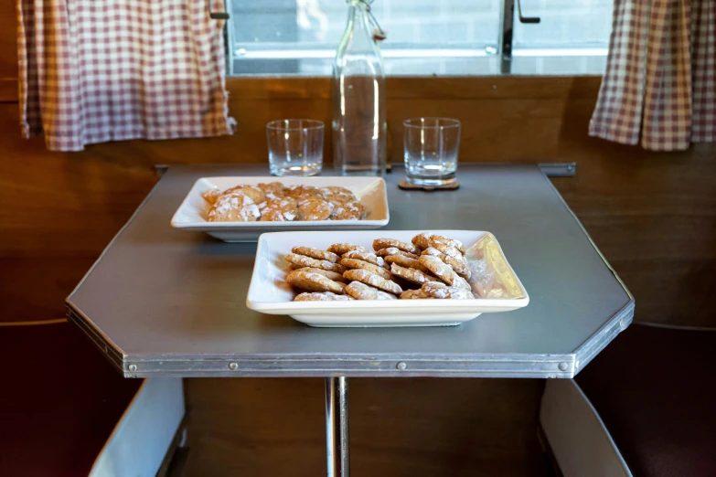 some plates of food and drinks sitting on a table