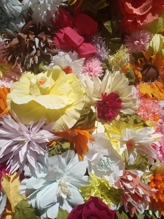 a bouquet of flowers in various colors of the same color