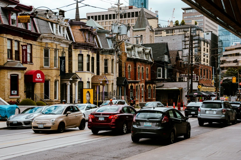 some cars that are sitting in the street