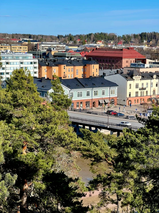 a city in the middle of a wooded area with lots of trees