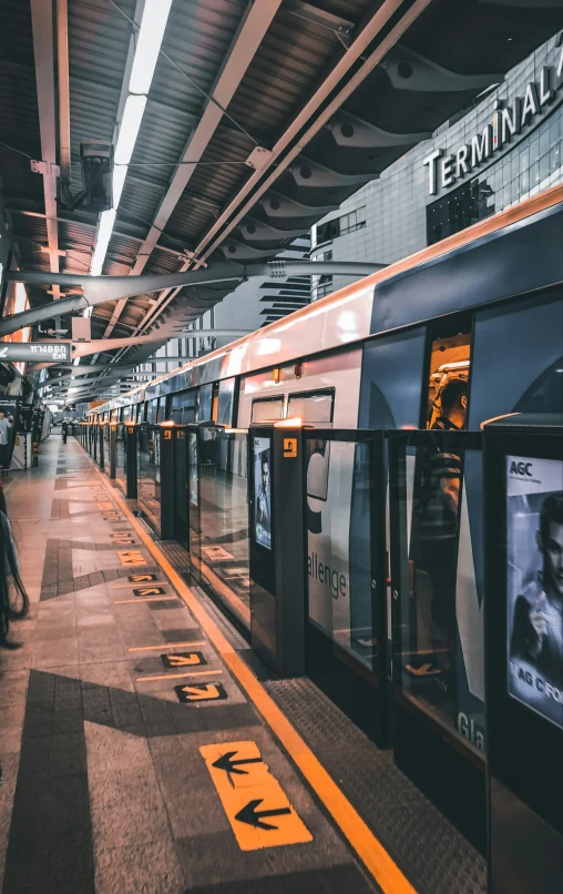 a train station with several train carts in it