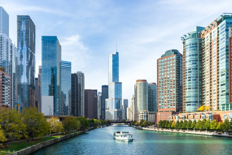 a boat on a river passing by some buildings