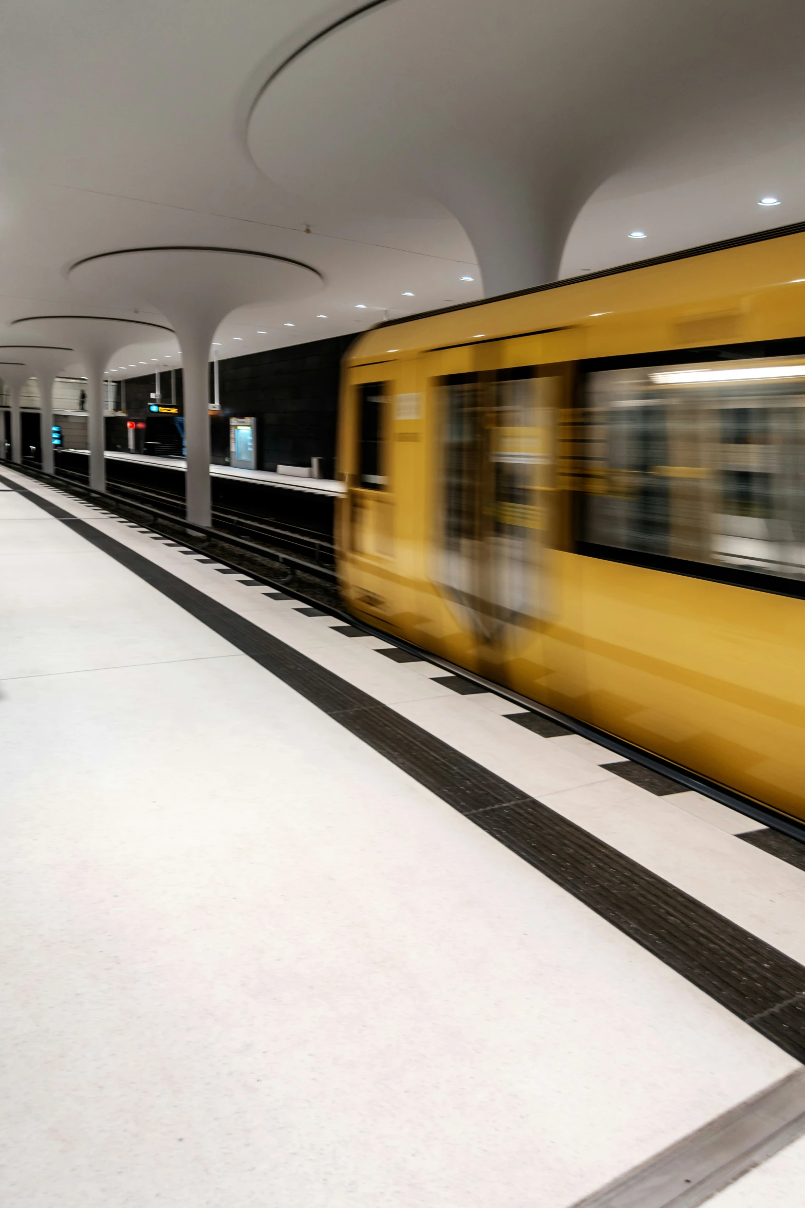 a train is running by some concrete floor